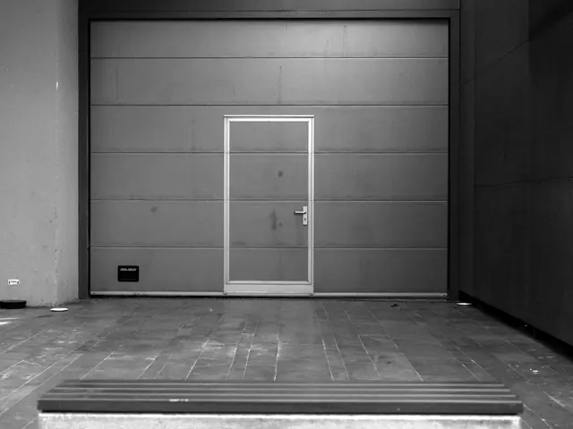 Closed sectional garage door with a side entry door