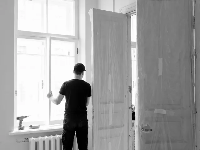 Technician working on a heritage door in a bright room